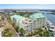 Waterfront condo showcasing multiple balconies, private rooftop terraces, and boat docks in a scenic coastal setting at 399 C 2Nd St # 313, Indian Rocks Beach, FL 33785