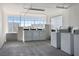 Shared laundry room with multiple washers and dryers, providing residents with convenient laundry facilities at 399 C 2Nd St # 313, Indian Rocks Beach, FL 33785