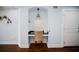Cozy office nook with a built-in desk, chair, and pendant lighting, perfect for a quiet workspace at 399 2Nd St # 313, Indian Rocks Beach, FL 33785