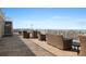 Relax on the patio with comfortable seating and a beautiful view of the cityscape and blue sky at 399 2Nd St # 313, Indian Rocks Beach, FL 33785