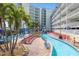Lounge by the lazy river with rows of chairs and umbrellas at this beach resort at 399 2Nd St # 313, Indian Rocks Beach, FL 33785
