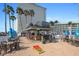 Inviting poolside bar and lounge area with ample seating and a festive atmosphere, perfect for relaxation and entertainment at 399 C 2Nd St # 313, Indian Rocks Beach, FL 33785