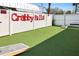 Recreational area with artificial grass and cornhole boards for outdoor entertainment at 399 2Nd St # 313, Indian Rocks Beach, FL 33785