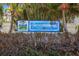 Harbourside at Marker 33 street sign near lush landscape and palm trees at 399 2Nd St # 313, Indian Rocks Beach, FL 33785