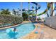 Lazy river at the resort with palm trees, lush plants, and a spiral waterslide in the background at 399 C 2Nd St # 313, Indian Rocks Beach, FL 33785