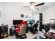 A game room featuring racing seats, steering wheels and multiple screens for a fun and immersive experience at 4025 Capri Coast Dr, Plant City, FL 33565