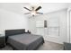 Neutral bedroom is showcasing a ceiling fan, and two large windows for an abundance of natural light at 4025 Capri Coast Dr, Plant City, FL 33565
