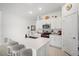 Bright kitchen featuring an island with seating and stainless steel appliances, creating a stylish and functional space at 4025 Capri Coast Dr, Plant City, FL 33565