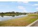 Scenic view of the pond and backyard, offering a serene and private outdoor space at 4025 Capri Coast Dr, Plant City, FL 33565