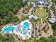 An aerial view features two community pools, a playground, and clubhouse at 4183 Ballantrae Blvd, Land O Lakes, FL 34638