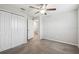 Bedroom featuring carpet, neutral walls, ceiling fan, a closet, and entry to another room at 4183 Ballantrae Blvd, Land O Lakes, FL 34638