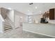 Open kitchen area that features modern appliances, wood cabinetry, granite countertops, and a breakfast bar at 4183 Ballantrae Blvd, Land O Lakes, FL 34638