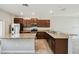 Bright kitchen with stainless appliances, granite counters, and an island, ideal for meal prep and gatherings at 4183 Ballantrae Blvd, Land O Lakes, FL 34638