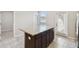 Kitchen island with granite countertop, offering additional workspace and storage at 4183 Ballantrae Blvd, Land O Lakes, FL 34638