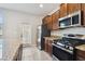 Beautiful kitchen with stainless steel appliances and granite countertops at 4183 Ballantrae Blvd, Land O Lakes, FL 34638