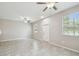 Inviting space with neutral paint, tile floors, and natural light through large windows creating a warm atmosphere at 4183 Ballantrae Blvd, Land O Lakes, FL 34638