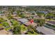 An aerial view showcases the home's location in a lush neighborhood with nearby amenities at 4340 50Th S Ter, St Petersburg, FL 33711