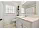 Bright bathroom features classic white fixtures and charming details, providing a refreshing space at 4340 50Th S Ter, St Petersburg, FL 33711
