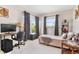 Comfortable bedroom with a functional workspace, natural light, and a cozy ambiance at 4340 50Th S Ter, St Petersburg, FL 33711