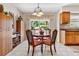 Cozy dining area with a view of the outdoors, a stylish light fixture, and a lovely table setting at 4340 50Th S Ter, St Petersburg, FL 33711