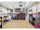 Well-organized garage with washer and dryer, storage shelves, and ample space at 4340 50Th S Ter, St Petersburg, FL 33711