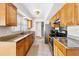 Well-lit kitchen with updated appliances, granite countertops, and ample cabinet space at 4340 50Th S Ter, St Petersburg, FL 33711