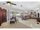 Bright living room with neutral colors, ceiling fans, and a view of the outdoors at 4340 50Th S Ter, St Petersburg, FL 33711