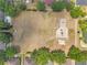 An aerial view of a community playground, surrounded by trees and homes, with multiple play structures at 4500 Fieldview Cir, Wesley Chapel, FL 33545