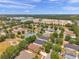 An aerial shot features a pond with a playground in a neighborhood with well-maintained homes at 4500 Fieldview Cir, Wesley Chapel, FL 33545