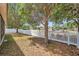 Backyard features a white picket fence, mature trees and view of community playground at 4500 Fieldview Cir, Wesley Chapel, FL 33545
