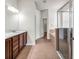 Bathroom with double vanity, glass door shower, and separate tub, tiled floors and natural light at 4500 Fieldview Cir, Wesley Chapel, FL 33545