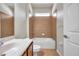 Bathroom with a shower-tub combo, tile surround, and vanity sink at 4500 Fieldview Cir, Wesley Chapel, FL 33545