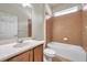 Updated bathroom features vanity with stone countertop and tiled shower/tub combo at 4500 Fieldview Cir, Wesley Chapel, FL 33545
