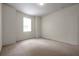 This bedroom showcases carpet, a window, and a neutral color scheme at 4500 Fieldview Cir, Wesley Chapel, FL 33545