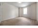 This bedroom features a neutral color scheme, carpet, and natural light at 4500 Fieldview Cir, Wesley Chapel, FL 33545