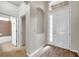The foyer features wood floors, natural light, and access to the bathroom at 4500 Fieldview Cir, Wesley Chapel, FL 33545