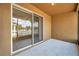 Enclosed lanai with sliding glass doors, overlooking white picket fence and a nearby playground at 4500 Fieldview Cir, Wesley Chapel, FL 33545