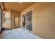 Covered lanai with a door leading to the backyard and sliding glass doors to the home's interior at 4500 Fieldview Cir, Wesley Chapel, FL 33545