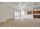 Open floor plan living room with ceramic tile, kitchen, and screened patio at 4500 Fieldview Cir, Wesley Chapel, FL 33545
