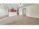 Bright living room featuring tile floors, kitchen view, and open floor plan at 4500 Fieldview Cir, Wesley Chapel, FL 33545