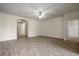 Living room with ceramic tile flooring, neutral paint, and entryways to other rooms at 4500 Fieldview Cir, Wesley Chapel, FL 33545