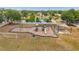 A playground featuring play structures, picnic tables, shade and surrounded by grass and fencing at 4500 Fieldview Cir, Wesley Chapel, FL 33545