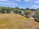 An aerial view of a community soccer field with nets, surrounded by trees and homes at 4500 Fieldview Cir, Wesley Chapel, FL 33545