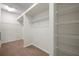 Walk-in closet featuring multiple wire shelving units for optimal storage and organization at 4500 Fieldview Cir, Wesley Chapel, FL 33545