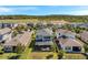 Aerial view showcasing screened patios, landscaped lawns, and a community ambiance at 4719 Tramanto Ln, Wesley Chapel, FL 33543