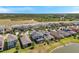 Lovely aerial view of a suburban neighborhood with well-manicured lawns at 4719 Tramanto Ln, Wesley Chapel, FL 33543