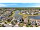 Stunning aerial view of the neighborhood with lake view homes, lush landscaping, and beautiful surroundings at 4719 Tramanto Ln, Wesley Chapel, FL 33543