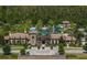 Stunning aerial view of The Club at Estancia, showcasing its luxurious amenities including a pool and waterslide at 4719 Tramanto Ln, Wesley Chapel, FL 33543