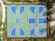 Overhead view of a community basketball court surrounded by trees and grass at 4719 Tramanto Ln, Wesley Chapel, FL 33543