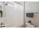 Bright bathroom featuring a shower and tub combination with white subway tile and neutral walls at 4719 Tramanto Ln, Wesley Chapel, FL 33543